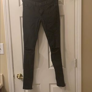 Black jeans with knee holes